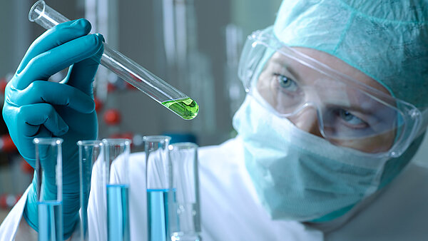 Pharmaceutical chemist creates test compounds for clinical trial.