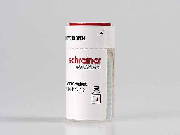 A tamper-evident security label wraps around a vial 