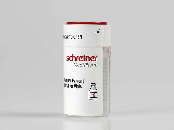 A tamper-evident security label wraps around a vial 