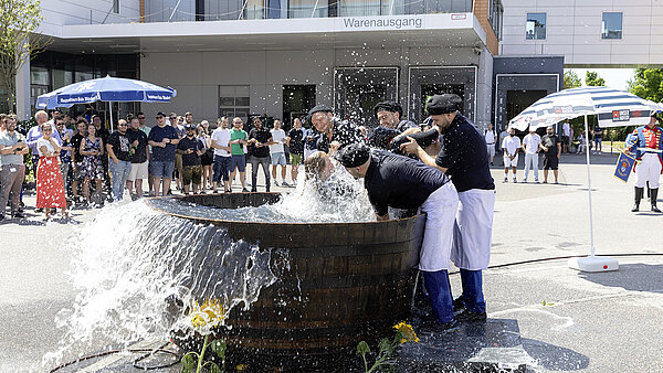 The Gautschfeier is the “baptism” of the young printers in the wooden vat after they have completed their training.