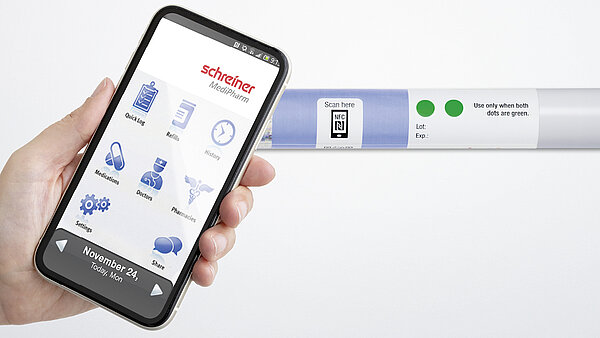 An NFC label on an autoinjector is read with a smartphone.
