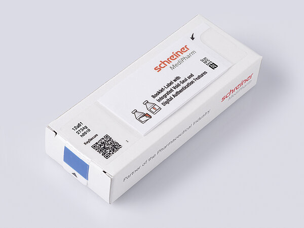Booklet-Label on folding box with integrated closure seal and KeySecure for digital traceability.